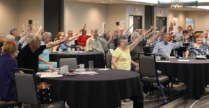 parkinson's group raising hands at event