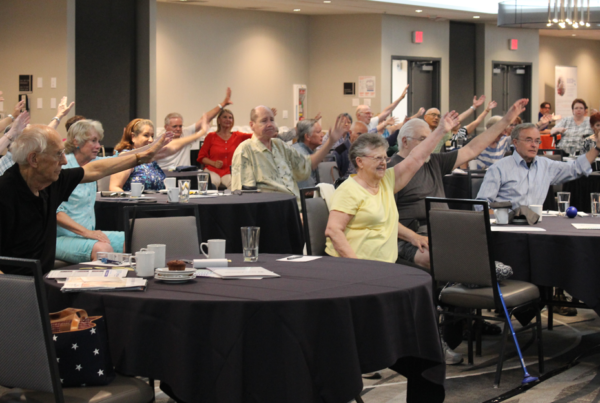 parkinson's group raising hands at event