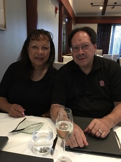 Spouses Denise and Bernard Coley at restaurant